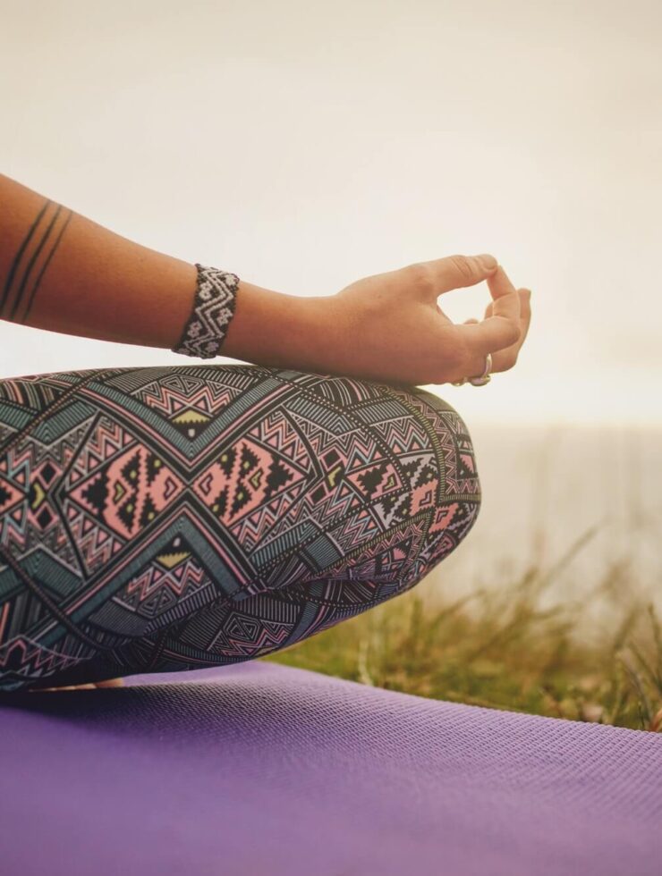 Young woman meditating outdoors