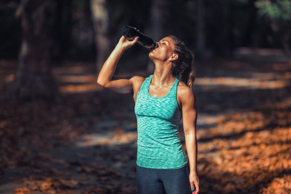 Woman Exercising Outdoors in The Fall